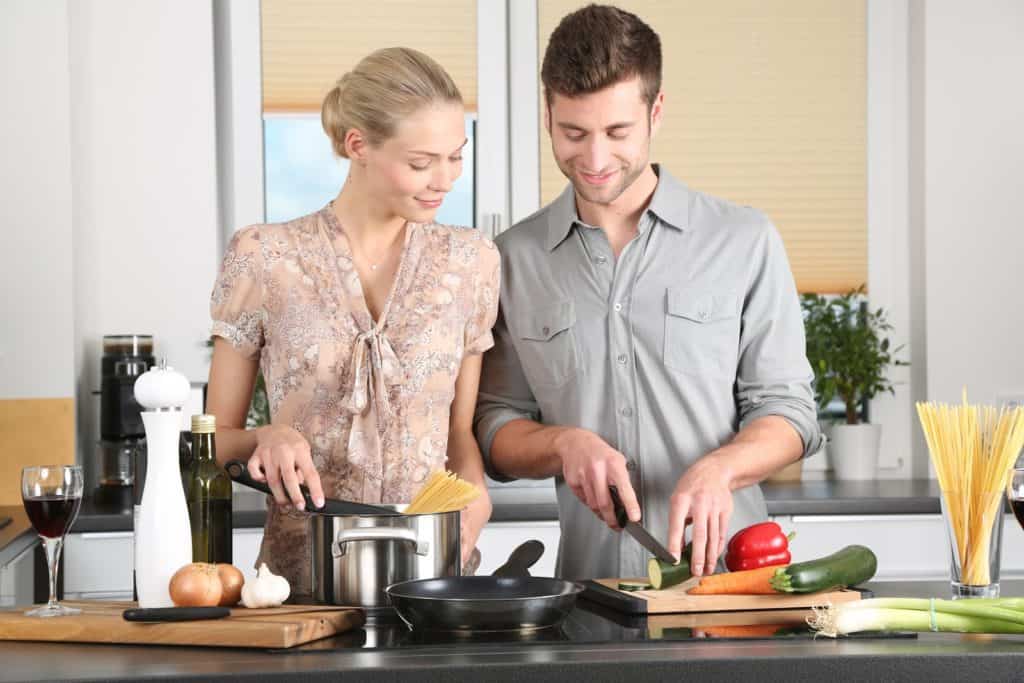 couple preparing dinner in the kitchen together