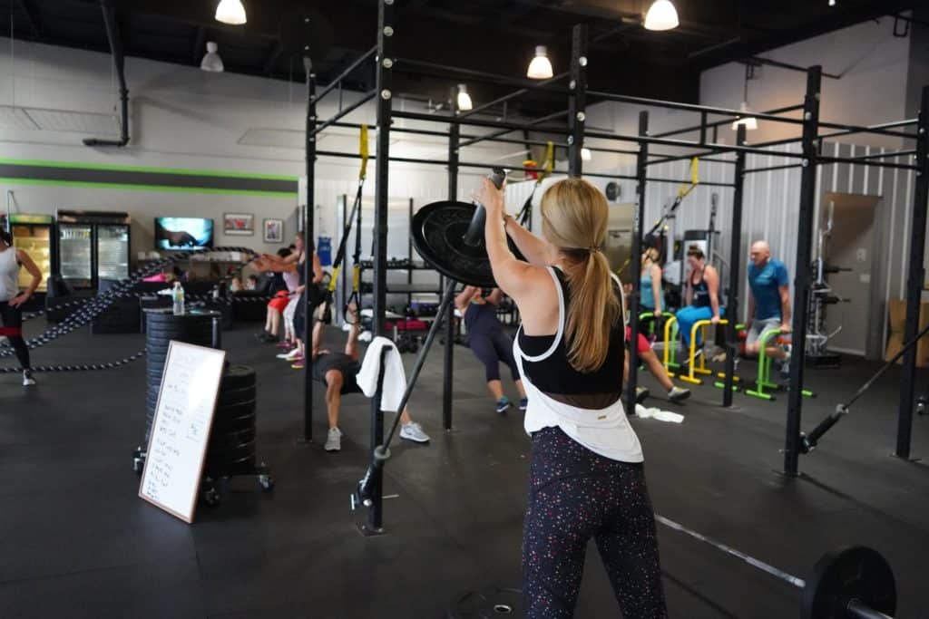 Woman Lifts Weights in Gym in New York City