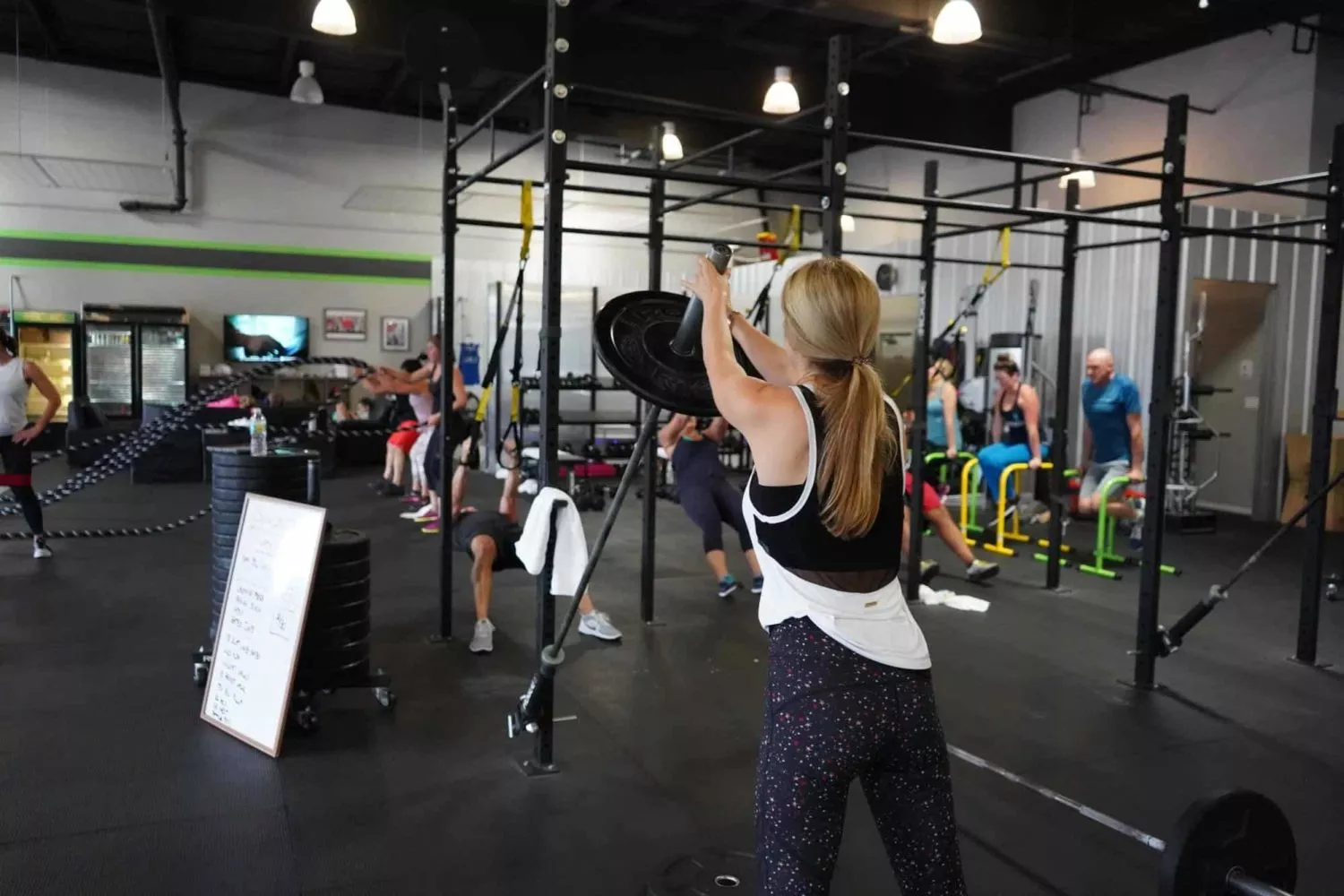 Woman Lifts Weights in Gym in New York City
