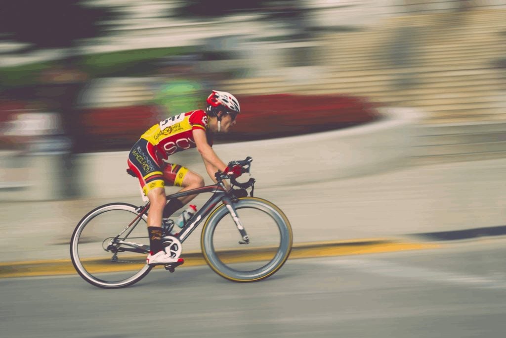 competitive cyclist bolting through a turn