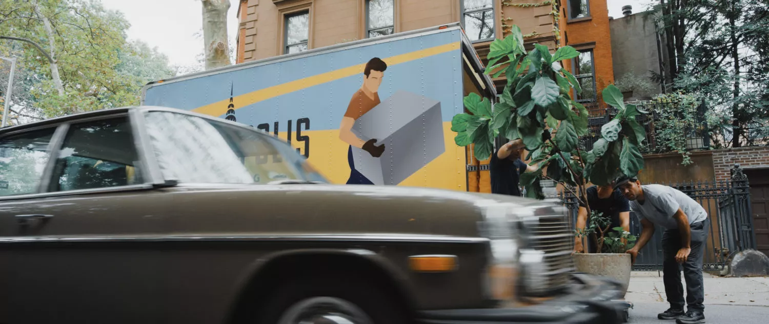 NYC movers moving across the street in traffic in Fort Green, Brooklyn