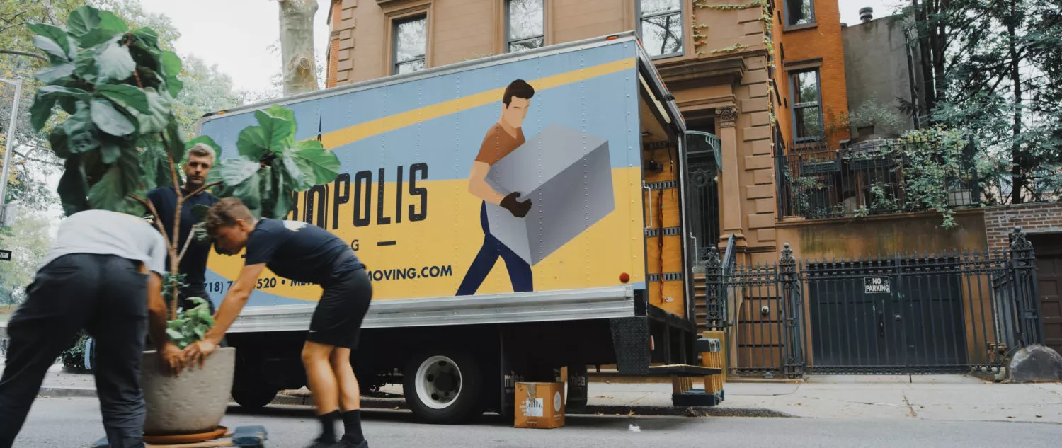 NYC movers moving across the street in traffic in Fort Green, Brooklyn