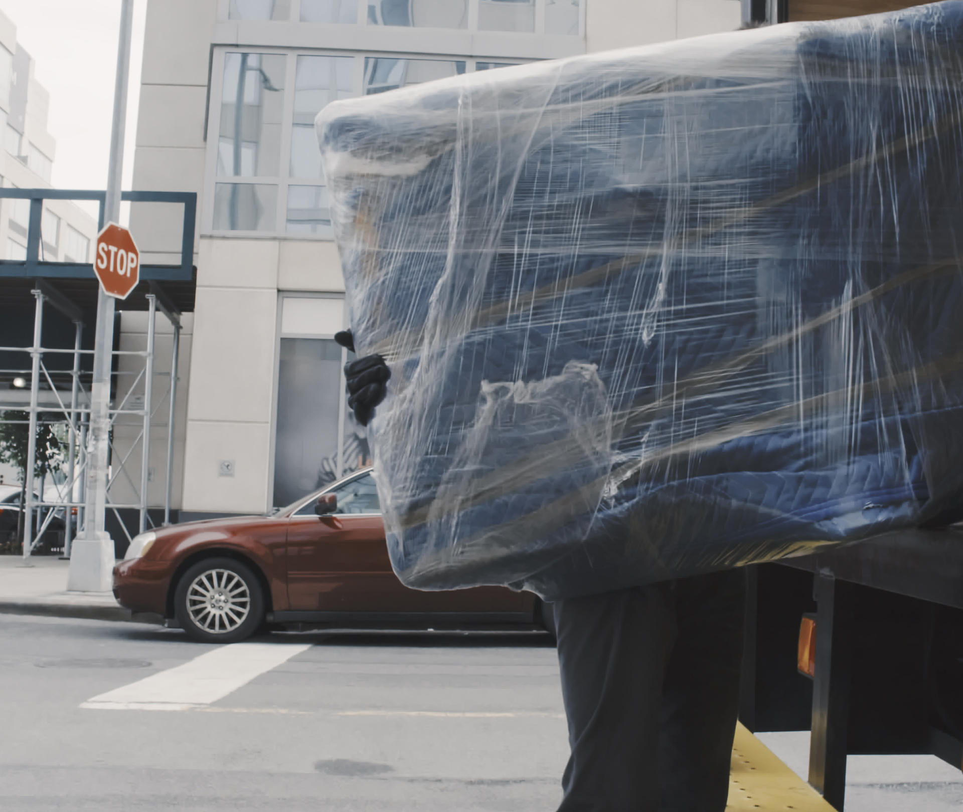 NYC movers loading TV into truck in Manhattan