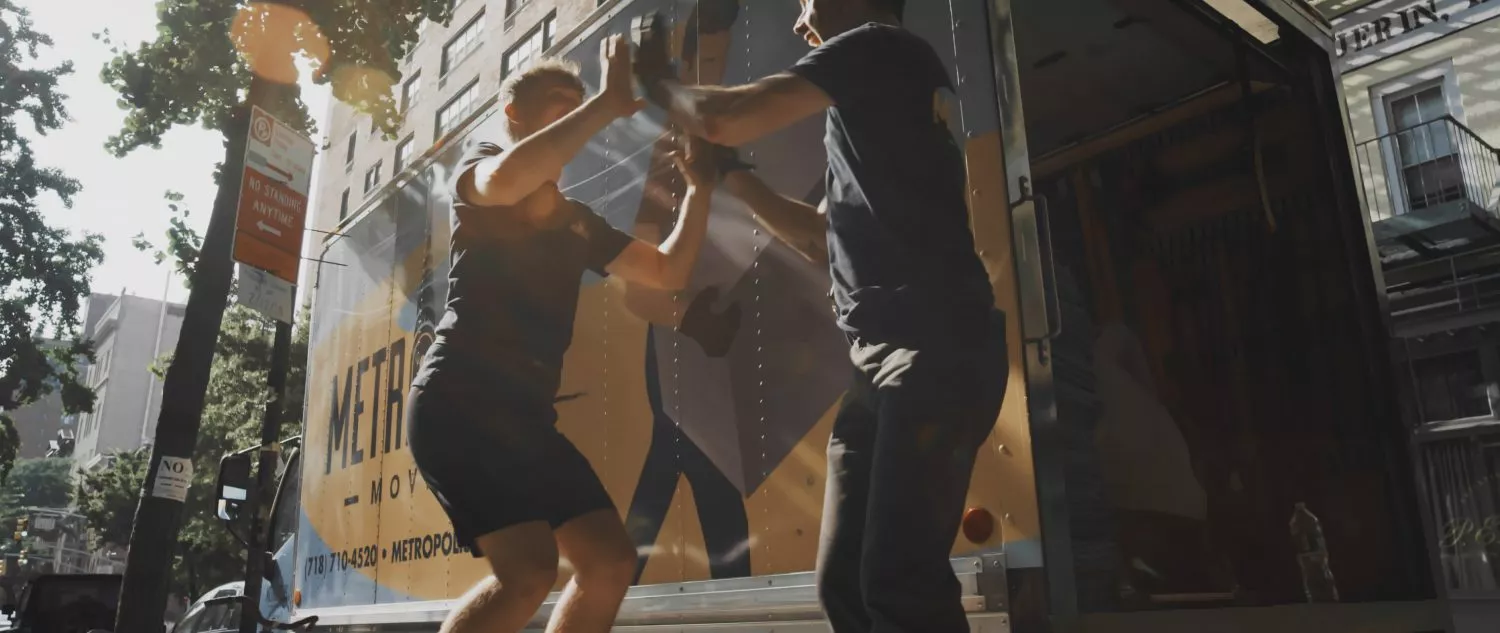 Friendly NYC movers high five