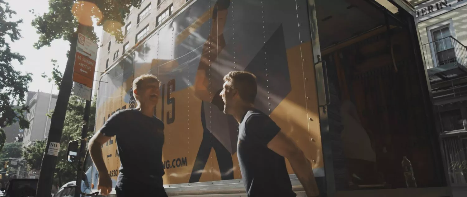 Friendly NYC movers high five