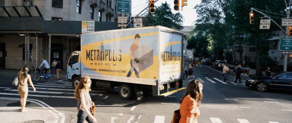NYC movers moving a plant across the street 0