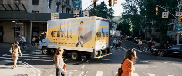 NYC movers moving a plant across the street 1