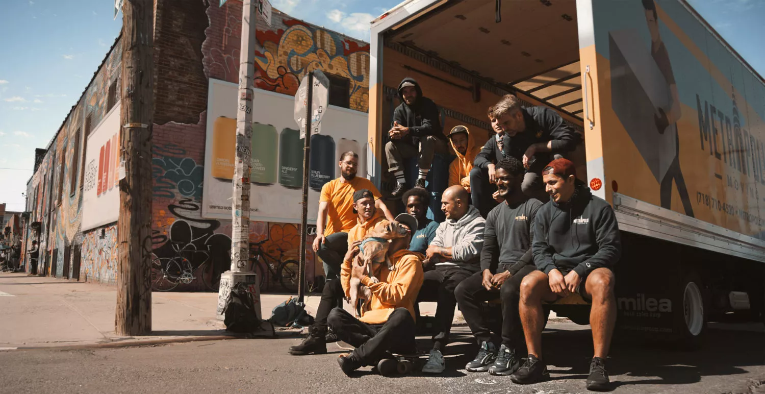 Brooklyn movers in the back of their truck with a dog in Bushwick