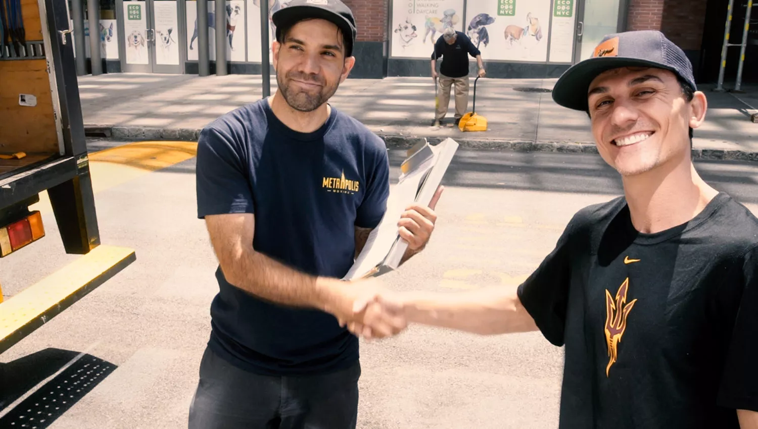 Happy NYC moving customer shaking hands with a mover
