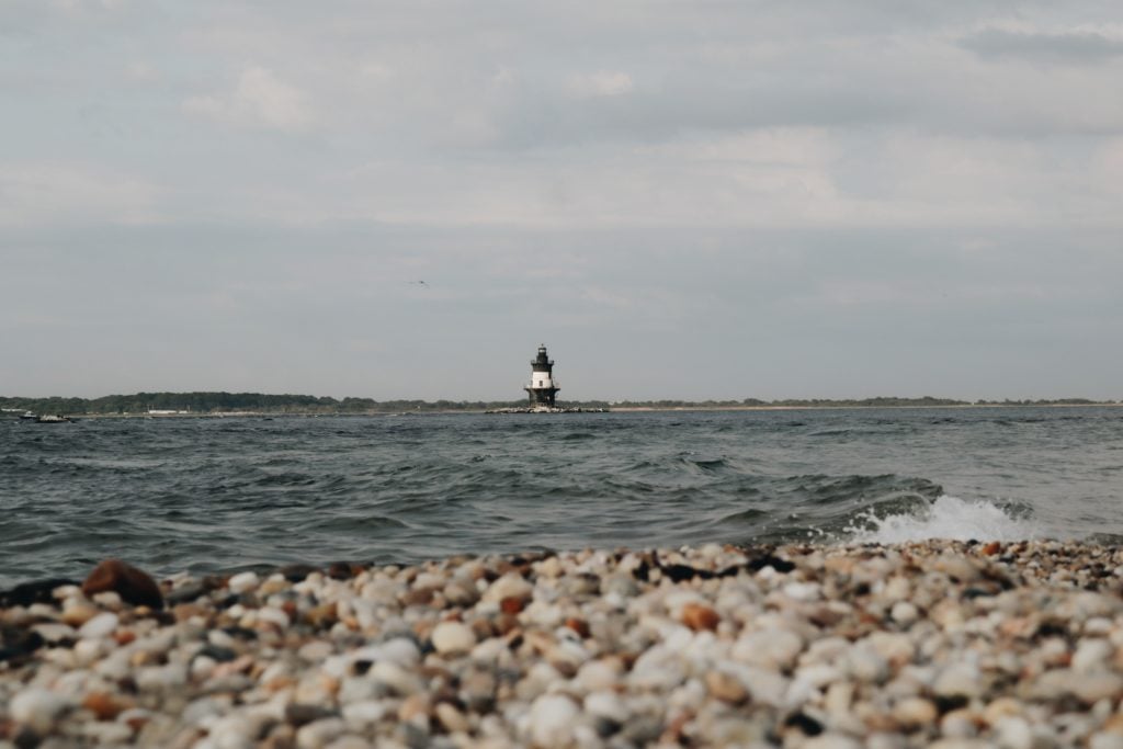 North Atlantic Lighthouse seen from a rocky shoreline