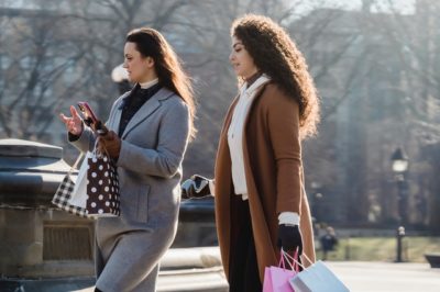 two young women walking through prospect park