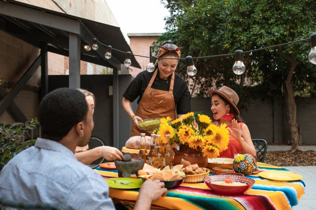 dominican food being served at a backyard patio