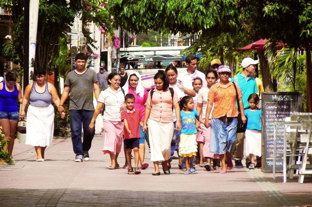 latino family walking through grand concourse bronx