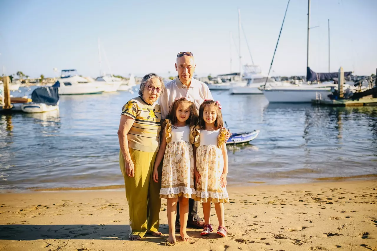 family standing in front of boat docks