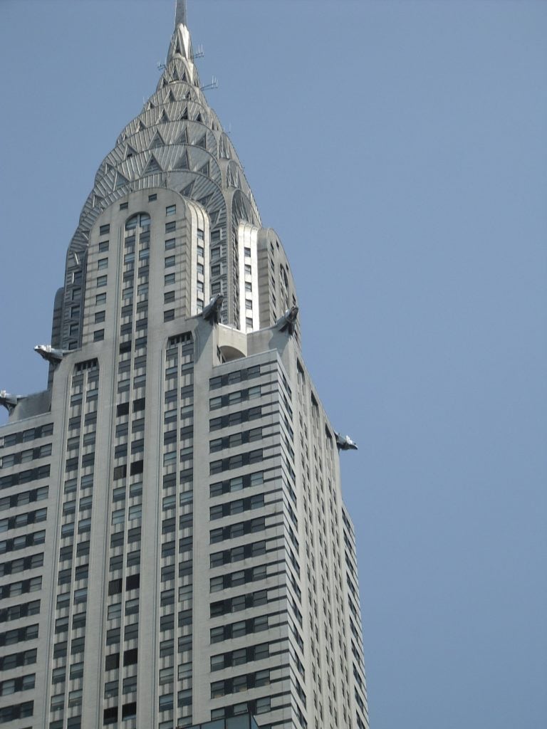 the chrysler building set against a blue sky backdrop