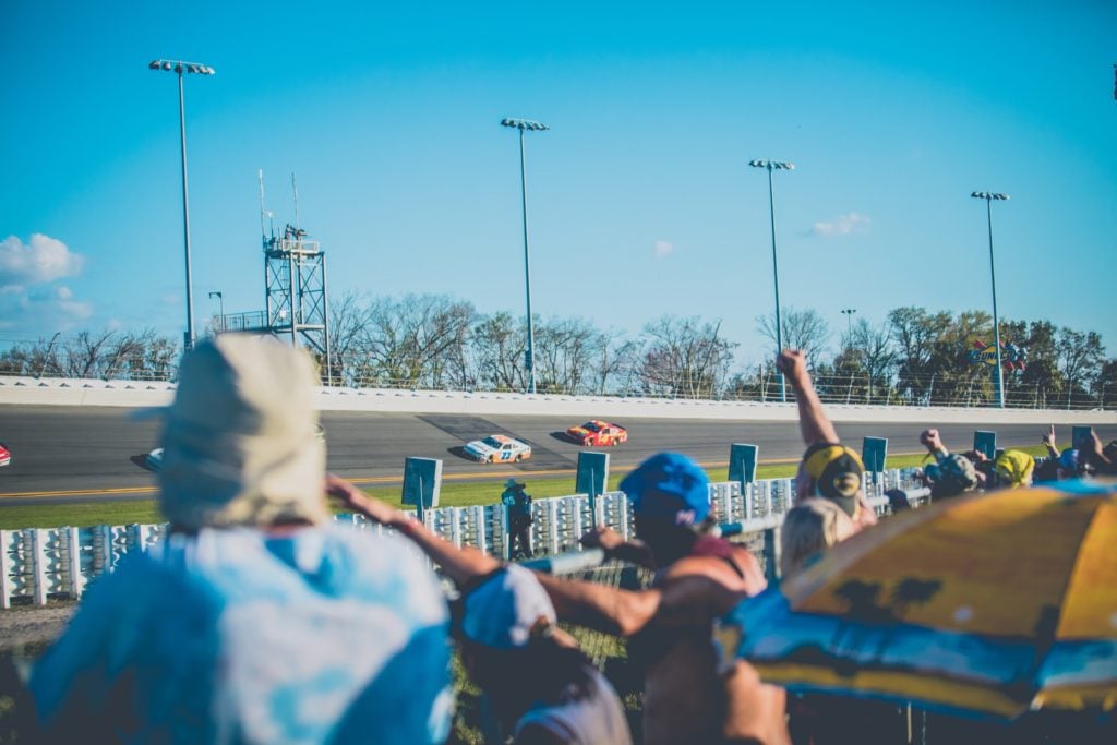 fans watching a NASCAR race at Daytona International Speedway
