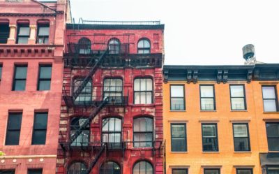 A picture of NYC apartments, painted red and yellow