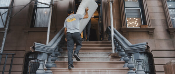 NYC movers moving chairs up stairs 2