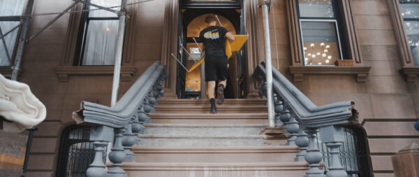NYC movers moving chairs up stairs 1